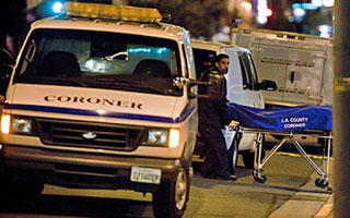 Photo: Jay Clendenin/Los Angeles Times -- A body is removed from a Hollywood hotel where a man reportedly connected to the killing of publicist Ronni Chasen allegedly committed suicide December 2, 2010