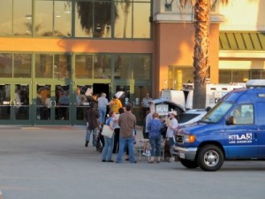 Photo: FLLewis/Media City G -- Anti-Walmart protestors and TV news vans outside the site of the former Great Indoors building in the Empire Center In Burbank October 19, 2011