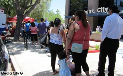 Photo: FLLewis/ Media City G -- Members wait in line for free lunch from In-N-Out burger truck at Burbank City Federal Credit Union June 19, 2014
