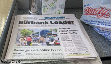 Photo: FLLewis/Media City G -- A stack of Burbank Leaders at a checkout stand in the Handy Market on Magnolia Boulevard in Burbank July 16, 2014