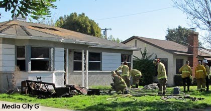 Photo: FLLewis / Media City G -- Burbank firefighters mopped up after a house fire at 326 South Griffith Park Drive December 29, 2014