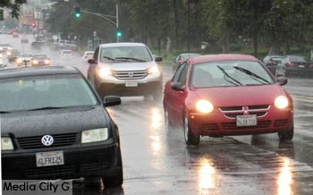 Photo: FLLewis / Media city G -- Stormy weather in Burbank forced motorists n West Alameda Avenue to turn on headlights and windshield wipers July 18, 2015