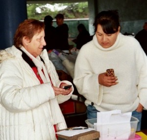 Photo: FLLewis/Media City G -- Burbank Coordinating Council Chair, Janet Diel (left) and volunteer Rosie Ortiz (right) at the Holiday Basket Program loading area at George Washington Elementary in Burbank December 18, 2010