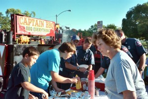 Photo: FLLewis/Media City G -- Burbank firefighters join the chow line at a huge neighborhood party/BBQ on National Night Out, August 3, 2010