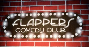 Photo: FLLewis/Media City G -- Flappers Comedy Club sign on the backdrop of the main stage