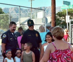 Photo: FLLewis/Media City G -- A group of children have a friendly exchange with some public servants at the NNO Chandler Boulevard block party in Burbank, August 3, 2010