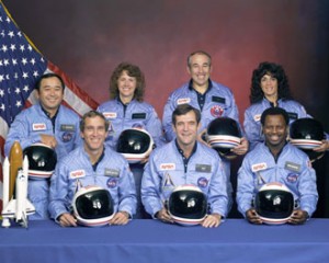 NASA Photo: Back row (L to R): Mission Specialist, Ellison S. Onizuka, Teacher in Space Participant Sharon Christa McAuliffe, Payload Specialist, Greg Jarvis and Mission Specialist, Judy Resnik. Front row (L to R): Pilot Mike Smith, Commander, Dick Scobee and Mission Specialist, Ron McNair.