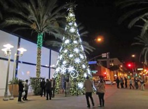 Photo: FLLewis/Media City G -- A huge walk-through Christmas tree on the AMC walkway at Palm and San Fernando Boulevard on a cold night in Downtown Burbank December 16, 2012