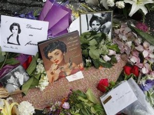 Photo: tula/Flickr -- Fans adorned the Hollywood star of the late actress Elizabeth Taylor with pictures, cards, flowers, and mementos March 2011