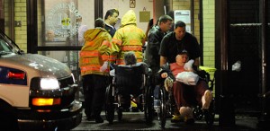 Photo: Robert Stolarik/The New York Times -- Workers scrambled to evacuate the elderly from a health care center in Queens, New York on Saturday night August 27, 2011