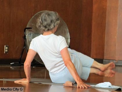 Photo: FLLewis / Media City G -- Participant demonstrated proper form for an exercise to work the sides during Pilates class at the Verdugo Recreation Center in Burbank August 6, 2014