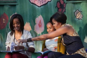 Photo: Samantha Appleton/White House  -- First Lady Michelle Obama and daughters Sasha and Malia read "The Cat In The Hat" to children at a daycare center in Johannesburg, South Africa June 21, 2011