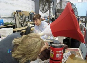 Photo: FLLewis/Media City G -- Connie Weir and Virginia Meyers add glue to the horn of the Victrola player at the float barn in Burbank December 28, 2013