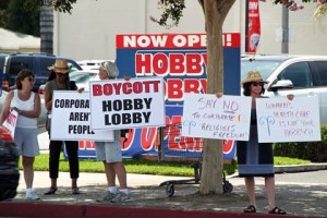 Photo: Greg Reyna Freelance Photog -- Protesters gathered at the entrance to the parking lot for Hobby Lobby in Burbank July 12, 2014