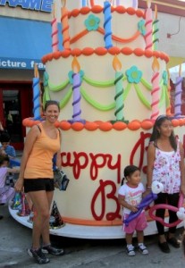 Photo: FLLewis/ Media City G -- A lot of partygoers posed for the cameras in front of a giant birthday cake honoring Burbank's centennial in Downtown Burbank July 8, 2011