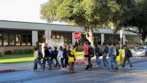 Photo: FLLewis/ Media City G -- Campus Supervisor Sherry Ross stopped traffic so students could safely cross West Jeffries Avenue to Luther Burbank Middle School winter, 2011