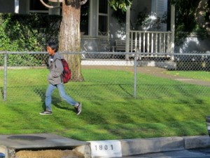 Photo: FLLewis/Media City G -- On the way to school, a Luther Burbank student walked on the grass area along the 1800 block of North Screenland Drive in Burbank March 7, 2011