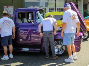 Photo: FLLewis/Media City G -- A couple of guys checked under the hood of a cool purple truck at Be-Boppin' in the Park in Burbank August 20, 2011
