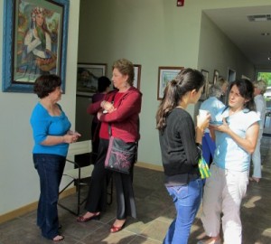 Photo: FLLewis/Media City G -- Artist Rosalba Acevedo (far left in blue) chatted with a guest during the water color art show and reception in Glendale March 12, 2011