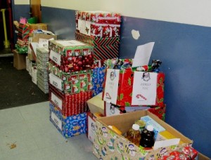 Photo: FLLewis/Media City G -- Hundreds of holiday baskets, boxes, and bags lined the walls outside the auditorium at George Washington Elementary school in Burbank December 16, 2011 