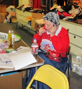 Photo: FLLewis/Media City G -- The driving force behind the Holiday Basket Program, Janet Diel, fielded cell phone calls at George Washington Elementary school December 16, 2011