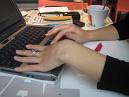 Photo of  woman typing at laptop keyboard