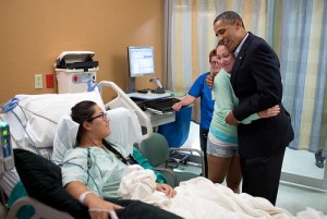 Photo: Pete Souza/White House -- President Obama visited Allie Young, victim of the Colorado theater shooting and gave her friend Stephanie Davies a big hug yesterday at the University of Colorado Hospital,  Aurora, CO July 22, 2012