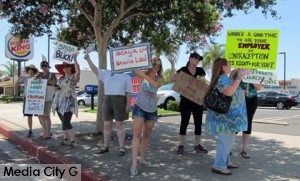 Photo: FLLewis/Media City  G -- Protesters gathered at the parking lot entrance to Hobby Lobby in Burbank July 5, 2014