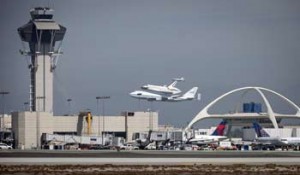 Photo: Bill Ingalls/NASA -- A 747 with Endeavour perched on top made a slow flyover at LAX before landing at that airport today September 21, 2012