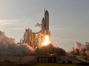 Photo: NASA TV -- Space Shuttle Discovery lifts off from the launch pad at Kennedy Space Center in Florida February 24, 2011