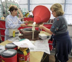 Photo: FLLewis/ Media City G -- Two Burbank Rose Parade float volunteers (l-r) Connie Weir and Virginia Meyers, worked on the Victrola record player December 28, 2013