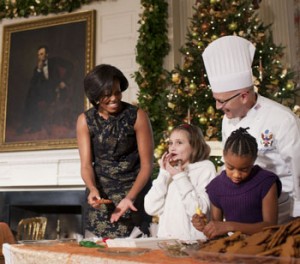 Photo: Lawrence Jackson/White House -- First Lady Michelle Obama and White House Pastry Chef Bill Yosses watch a young visitor taste some freshly baked holiday cookies December 1, 2010