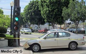 Photo: FLLewis/ Media City G -- Car slammed into traffic signal light pole in front of Porto's in Burbank July 28, 2014