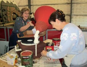 Photo: FLLewis/Media City G -- Connie Weir and Virginia Meyers added cranberry seeds to the horn of the Victrola record player in the float barn Burbank December 28, 2013