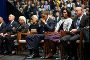 Photo: from the White House Blog -- First Lady Michelle Obama sat between President Obama and Astronaut Mark Kelly, the husband of Congresswoman Gabrielle Giffords at the memorial for the mass shooting victims January 12, 2011
