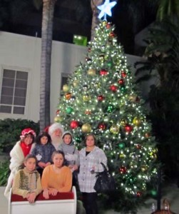 Photo: FLLewis/Media City  G -- A group of visitors to the Mayor's Annual Tree Lighting Ceremony took a photo with Santa and Mrs. Claus after the festivities Burbank November 7, 2013