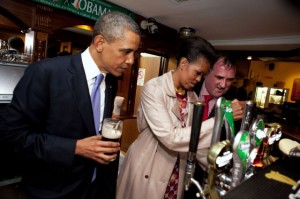 Photo: Pete Souza/White House -- President Obama watches as First Lady Michelle Obama draws a pint at Ollie Hayes' Pub in Moneygall, Ireland May 23, 2011