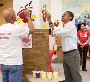 Photo: Pete Souza/White House -- President Obama helps paint fruit in a Washington DC school as part of a service project on MLK Day January 17, 2011
