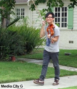 Photo: FLLewis/ Media City G -- An actor serenades the morning with his violin in Burbank August 8, 2014
