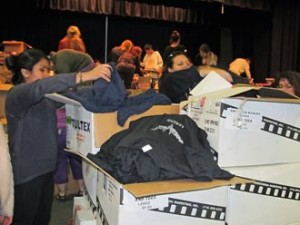 Photo: FLLewis/Media City G -- Volunteers sorted through boxes of donated tee shirts at George Washington Elementary School in Burbank December 13, 2013