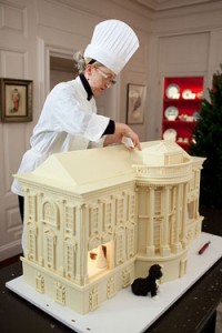 Photo: Chuck Kennedy/ White House -- Assistant pastry chef Susie Morrison puts some finishing touches on the White House gingerbread house in the China Room November 29, 2010